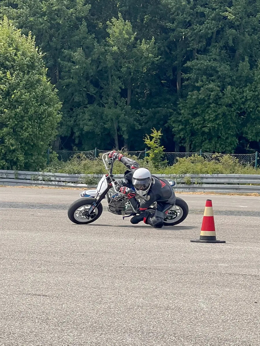 Fine motor skills at the limit of adhesion: precise circling around the cone to train traction control.