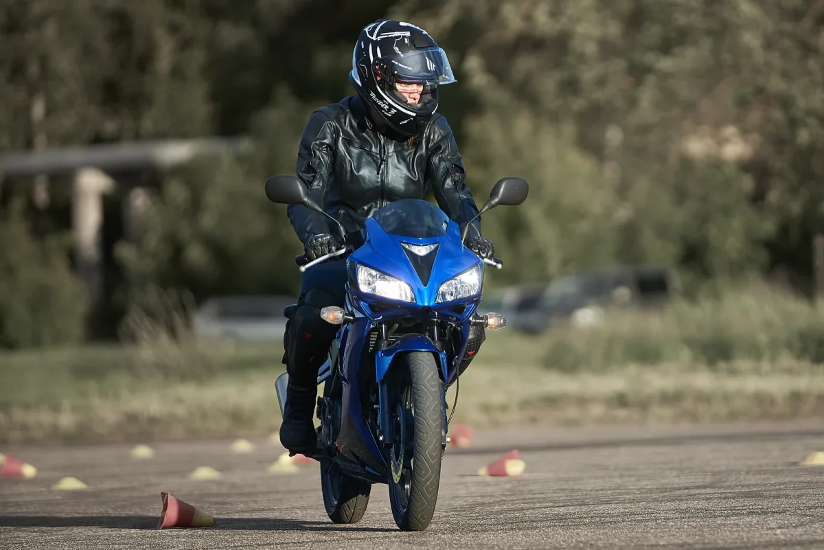 A rider in the cone course during riding safety training – controlled run through the practice lane.