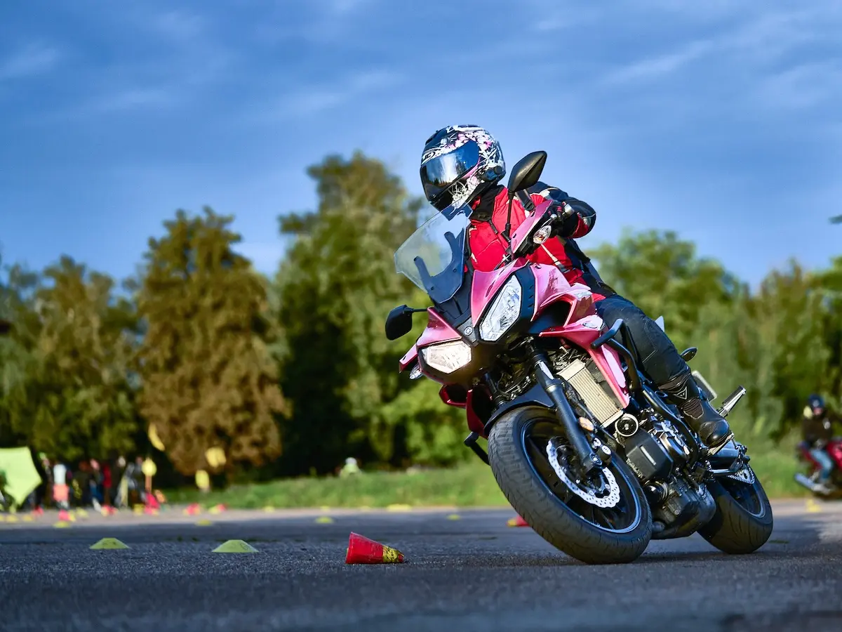 A participant in the riding safety training in a tight slalom between cones – low-speed control with clutch, throttle and rear brake.